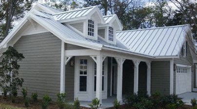 grey house with silver metal roof|grey house with black awnings.